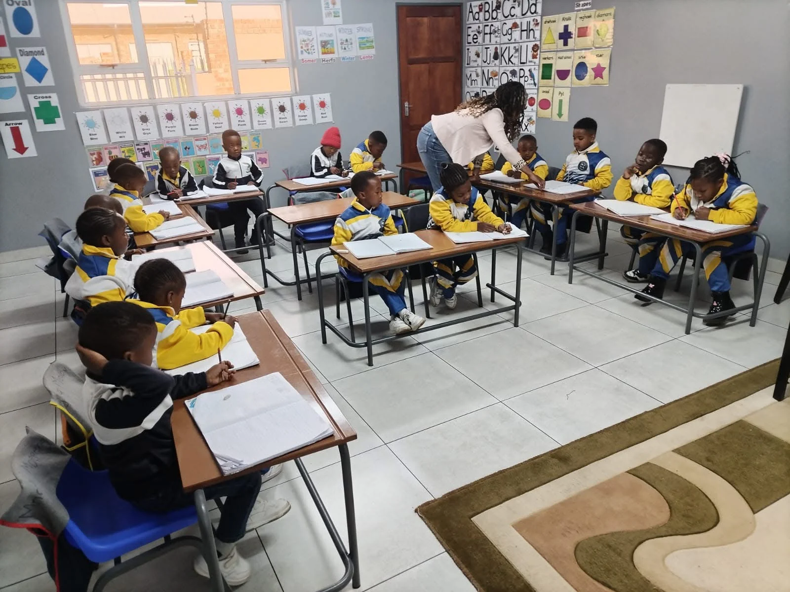 St Patrick’s learners working with a teacher in their classroom